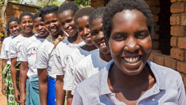 Onesta Banda with a group of lead mothers in the village of Dzidzwa, Mchingi District, Malawi. These women have been very effective in influencing parents to rethink their approach to child nutrition and issues of health and sanitation. Photo: Kieran McCo