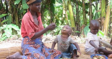 A mother feeds her baby with a balanced, nutritious meal