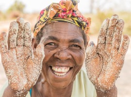 Mother and grandmother Ernestine sells sugar and flour on the road. She began this business with the help of Concern in Manono, Tanganyika. Photo: Pamela Tulizo/ Panos Pictures