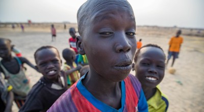Kids goofing around in front of the camera while they take a small break from their soccer game in Bentiu's PoC. Photo: Steve De Neef / Concern Worldwide.