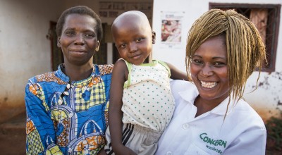 Nutrition Officer, Grekpengou Mathilde, with five year old Mario Doutifed and his mother, Remadere Clemantine at the Concern-supported health centre in Boyal, Central African Republic. Mario and Clemantine spent time hiding in the bush following fighting and he was treated by Concern for severe acute malnutrition. CAR. Photo: Kieran McConvillle/Concern