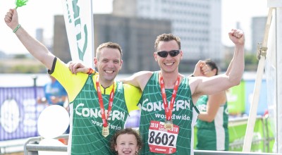 Triathlon participants taking part on behalf of Concern celebrate at the end of the AJ Bell Triathlon 