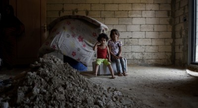 Syrian refugees *Alya, aged 5, and her cousin *Sultan, aged 4, are pictured in the home they share with their family and cousins after being moved by Concern as they were in danger. Photo: Mary Turner