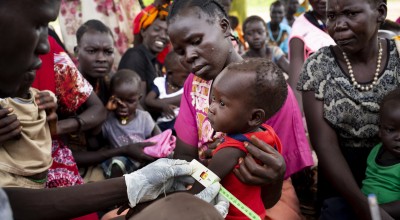 People gather for a Concern Worldwide nutrition clinic, South Sudan. Photo: Abbie Trayler-Smith