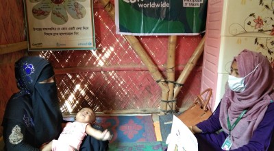 A nutrition counsellor helps a mother and her baby in Cox's Bazar, Bangladesh