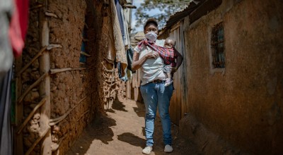 Baby Charlyne and Margret Wanjiru in the alleyway outside there home in Kibera. Nairobi. Photo: Ed Ram