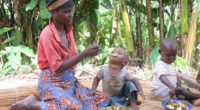 A mother feeds her baby with a balanced, nutritious meal