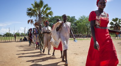 A group of women collect rations from a Concern food distribution in South Sudan, where over a million people have been displaced by conflict.