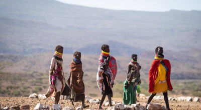 Women and children arrive at a health centre where their children will be screened for malnutrition and receive treatment, Sasame Dispensary, Kibish North in Kenya's Turkana province. Photo: Lisa Murray/Concern Worldwide