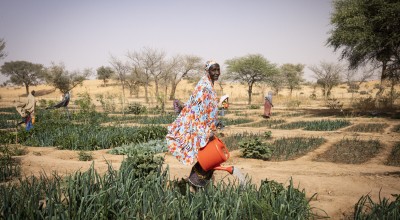 Doma, 70, has been working in the garden for 4 years since the garden began. Doma says with the diversity of the vegetables they grow in the garden the children are healthier. Photo: Ed Ram/Concern Worldwide