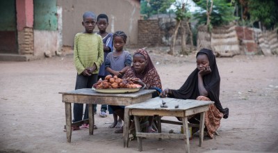 Children set up a stall to sell their wares to early morning passers-by in the town of Kouango,Central African Republic. Photo: Kieran McConville / Concern Worldwide