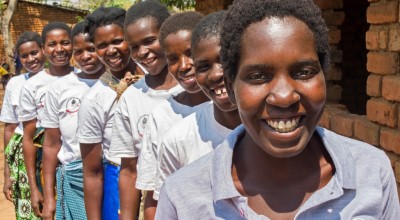 Onesta Banda with a group of lead mothers in the village of Dzidzwa, Mchingi District, Malawi. These women have been very effective in influencing parents to rethink their approach to child nutrition and issues of health and sanitation. Photo: Kieran McCo