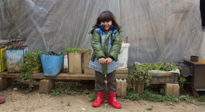 Syrian refugee Ola, wears her winter clothes that were distributed to her by the Concern team at the informal tented settlement in the village of Bebnine, in Akkar, north of Lebanon. Photographer: Dalia Khamissy