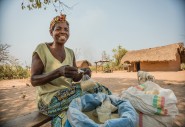 Ernestine, mother and grandmother of a large family, sells sugar and flour on the roadside, an income-generating activity she began with the help of Concern’s Graduation Project in Manono, Tanganyika. Photo: Pamela Tulizo/ Panos Pictures