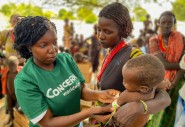 Concern staff checks the health of Nyanga (2.5 years old) at a health clinic in Marsabit, Kenya. Photo: Jennifer Nolan / Concern Worldwide 